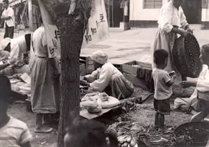 Towns folk selling, buying goods South Korea 1960's